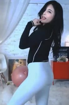 Asian girl dances leather trousers