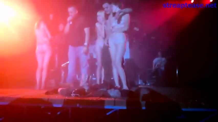 Audience girl strips stage during concert