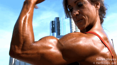 Female muscle flexing biceps
