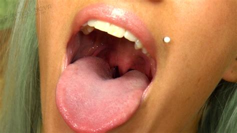 Long tongue licking lips showing uvula