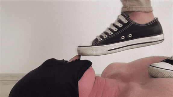 Mistress tramples slave with sneakers very