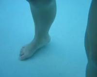 Trina Mason swimming with fully clothes wetlook underwater.